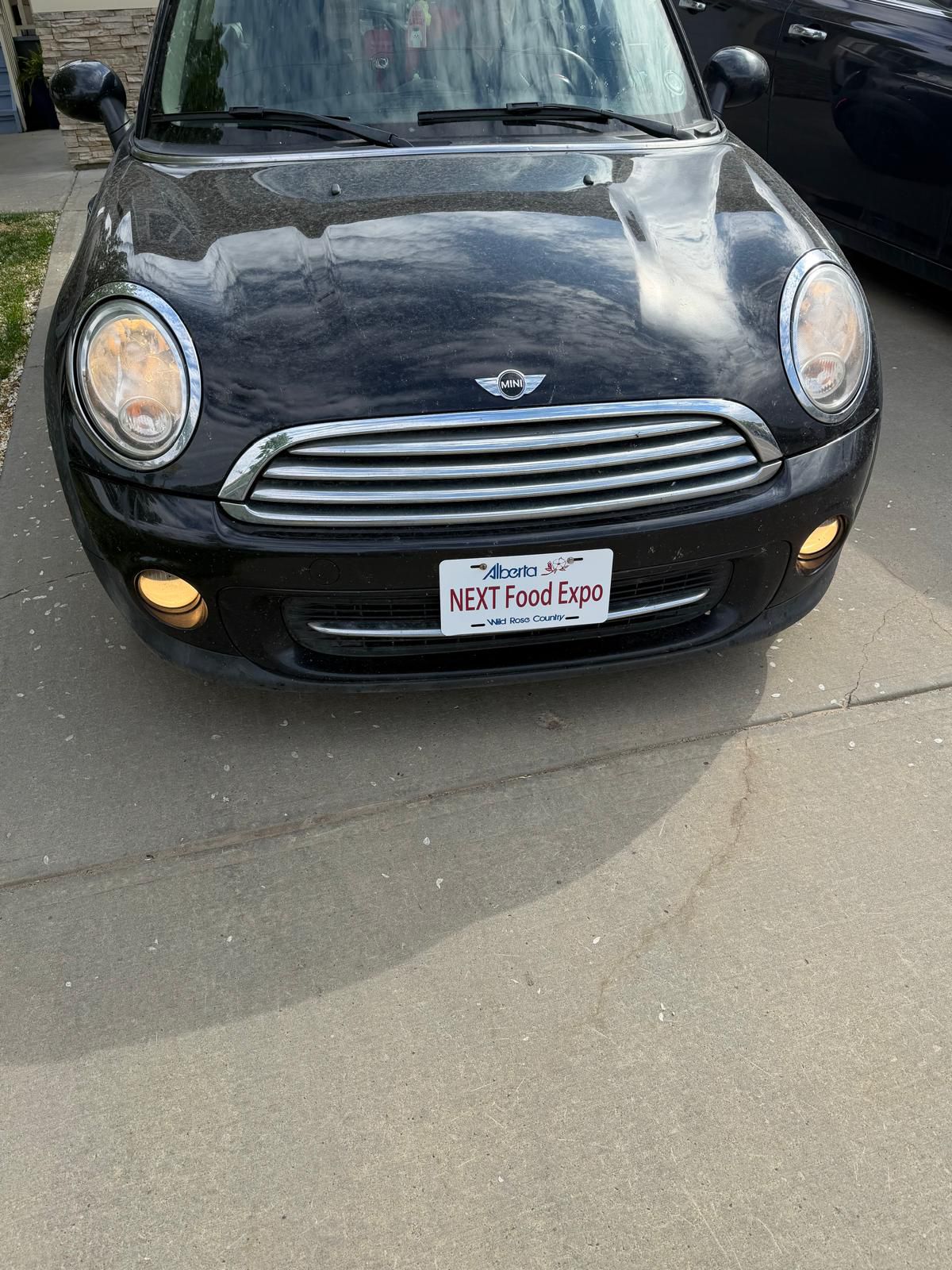 NEXT Food Expo branded plate on Mini Cooper