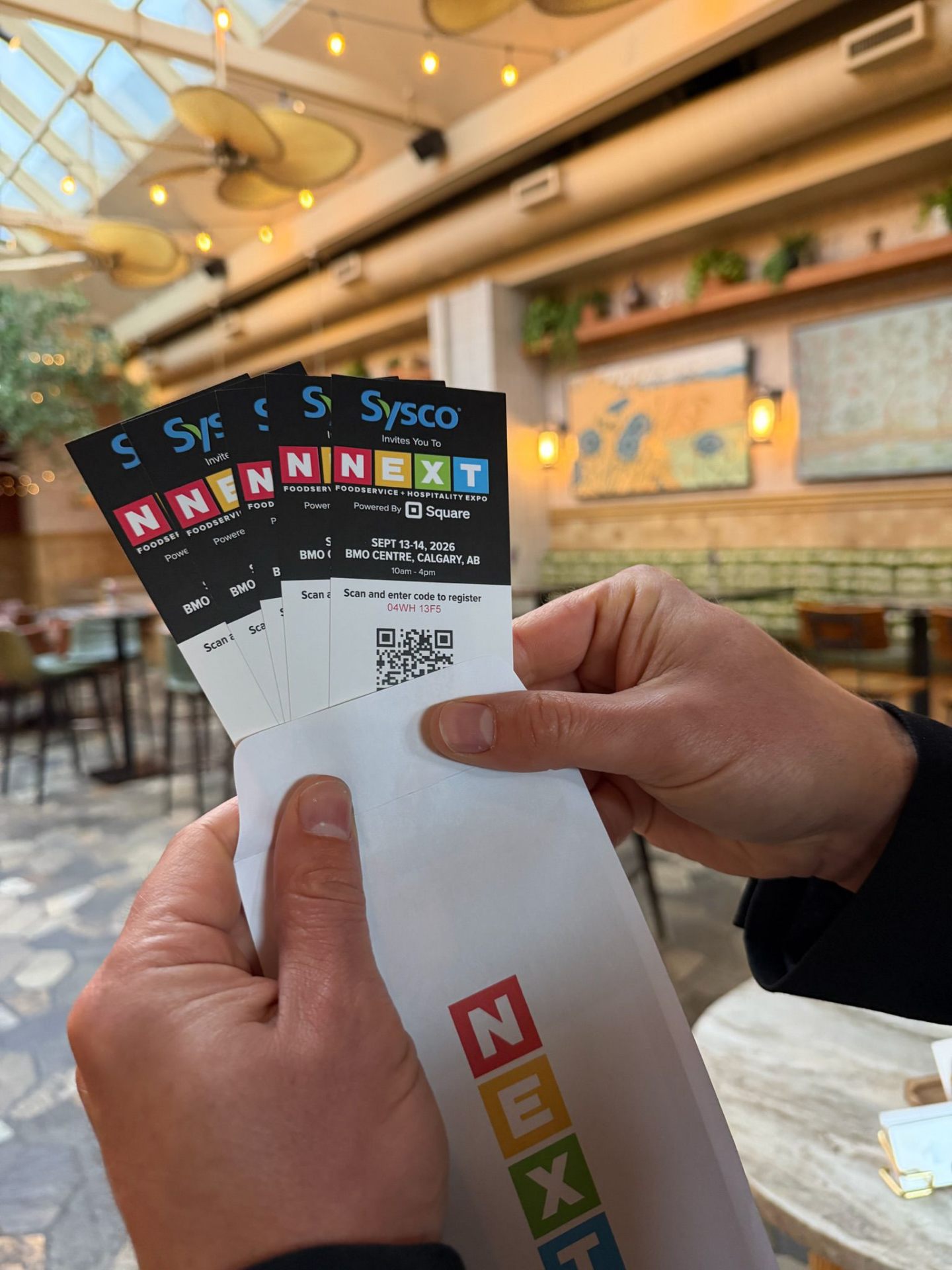 Fanned NEXT Food Expo tickets at a Calgary cafe