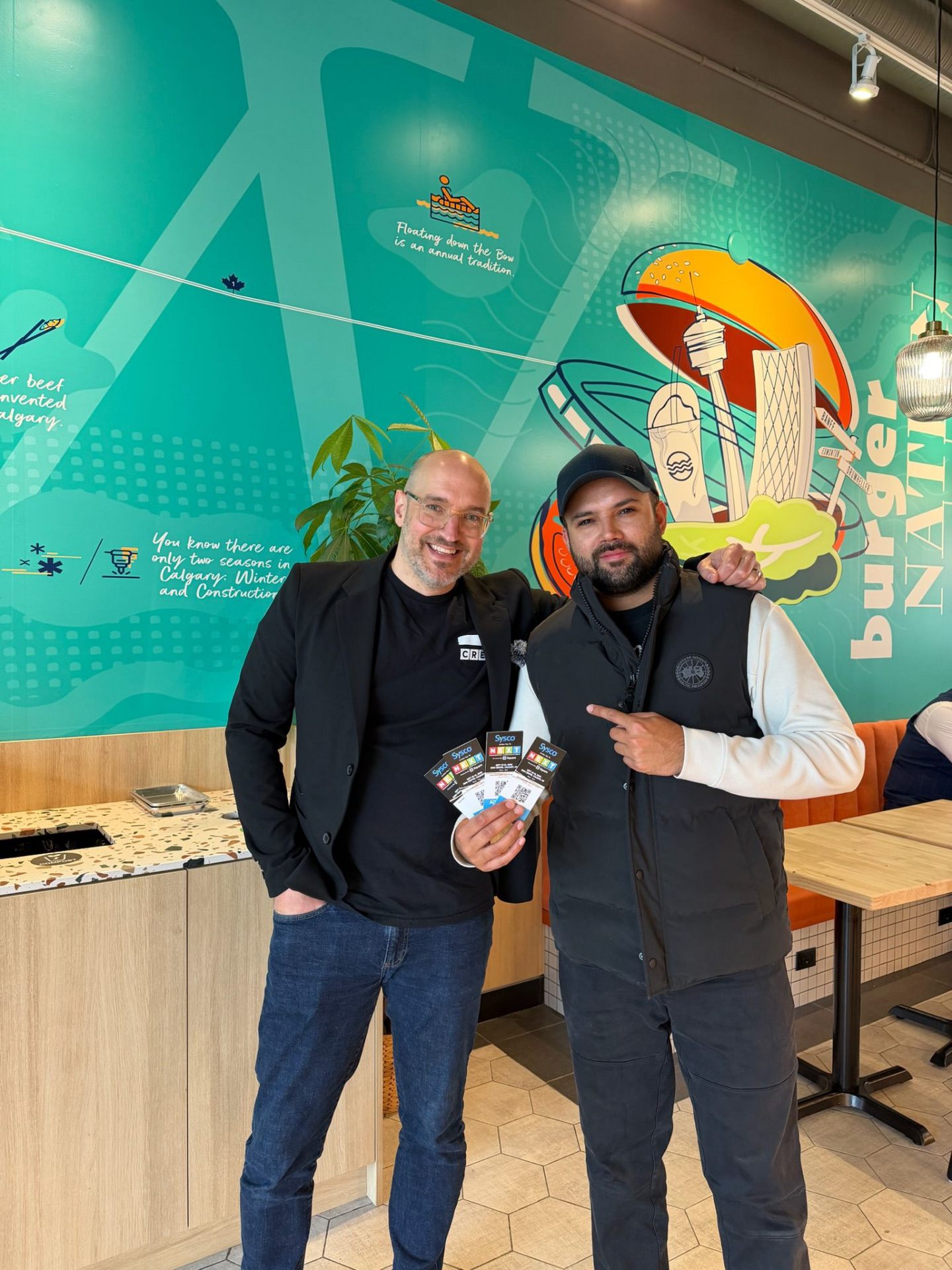 Street team handing NEXT Food Expo tickets to Burger Nation operator